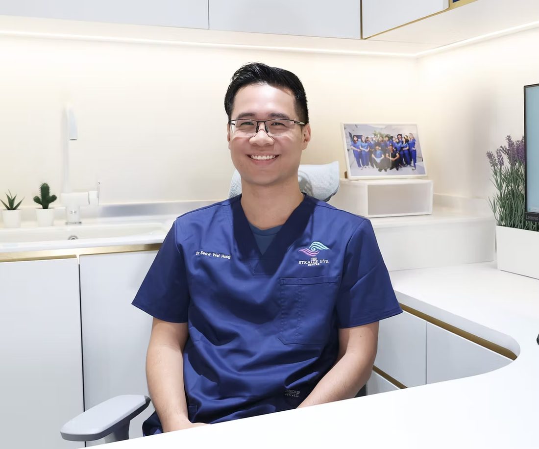 Dr Seow Wei Hong seated at a consultation desk in the clinic.