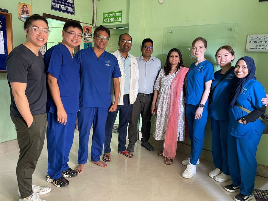 Dr Jayant V Iyer with the Vision Mission team and local clinic staff inside an overseas eye clinic.